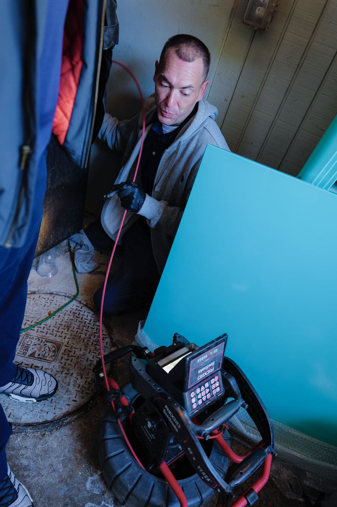 Sunshine State Plumbing technician performing drain and sewer work in the field