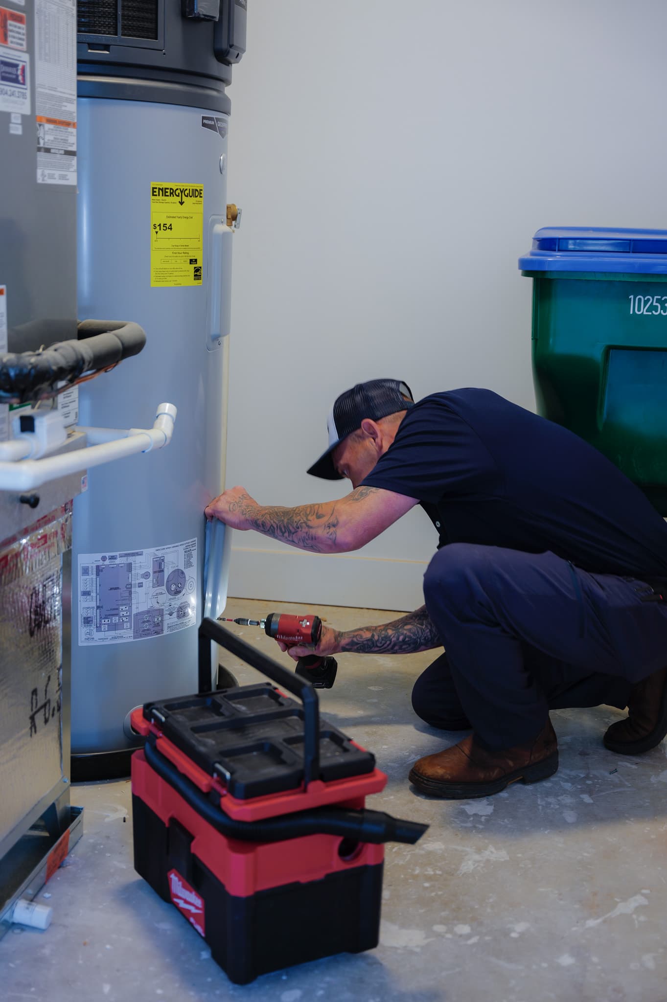 Sunshine State Plumbing technician installing a water heater
