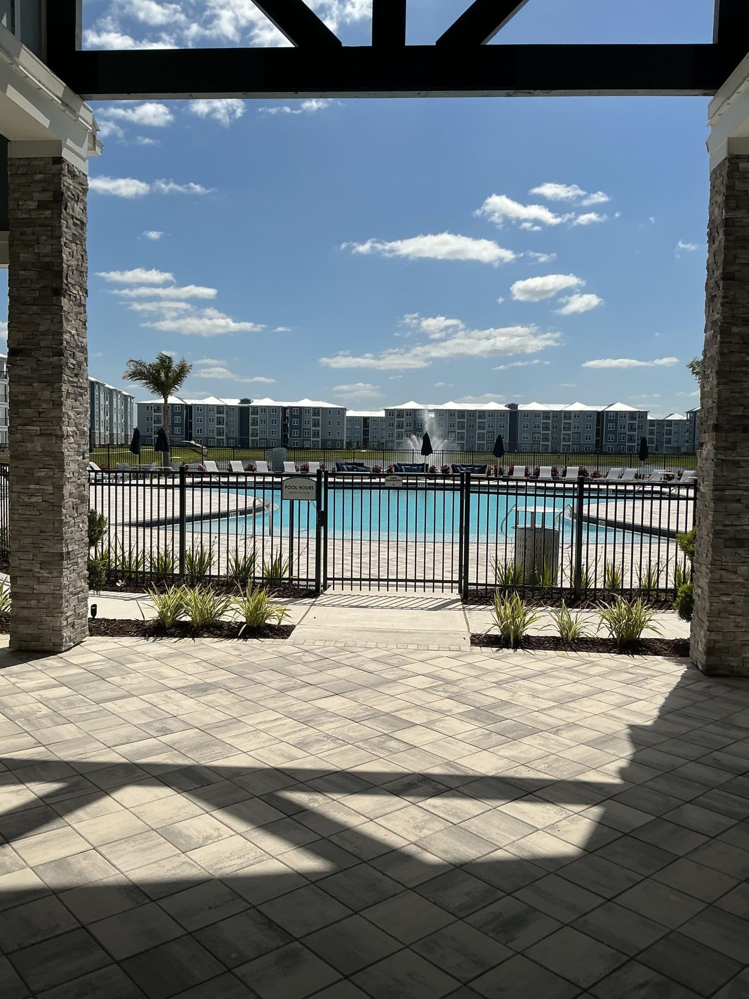 Completed amenity pool with fountain at a multifamily community