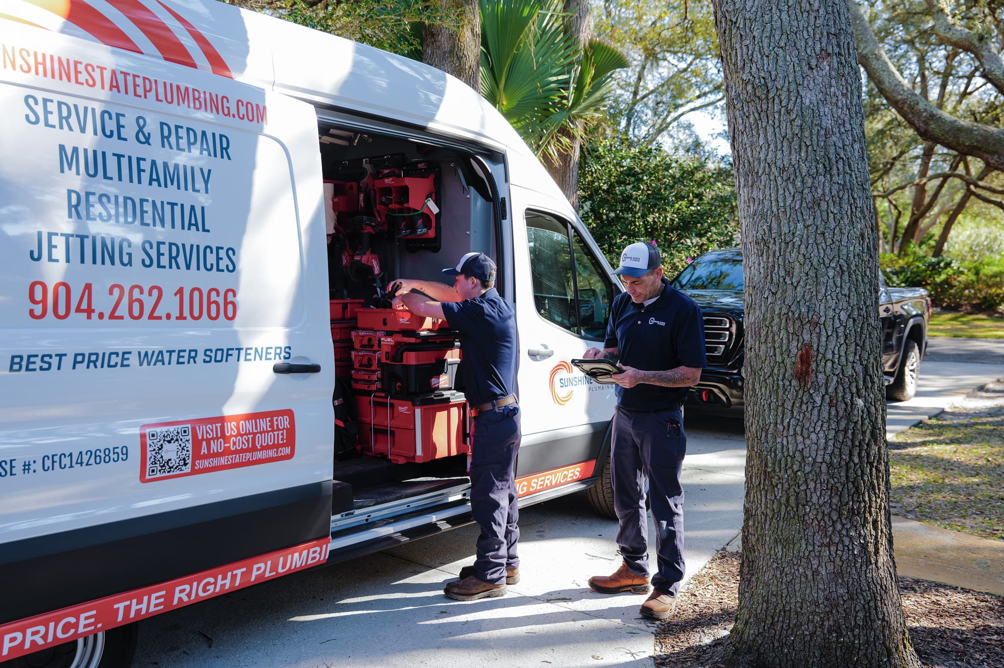 Sunshine State Plumbing technicians with a service truck